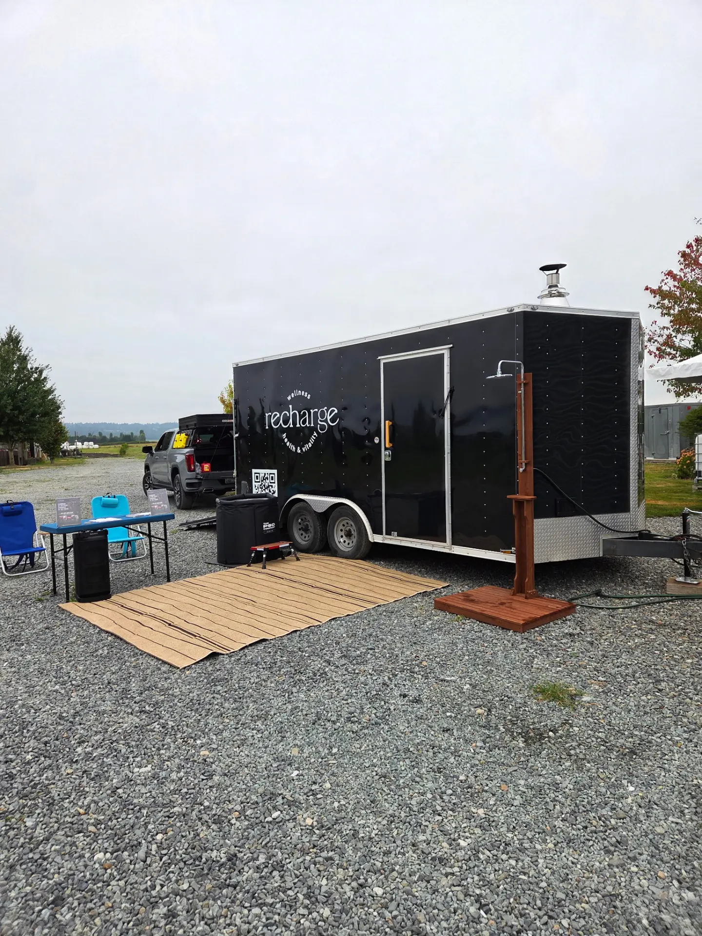 The Recharge mobile sauna trailer set up at an outdoor event