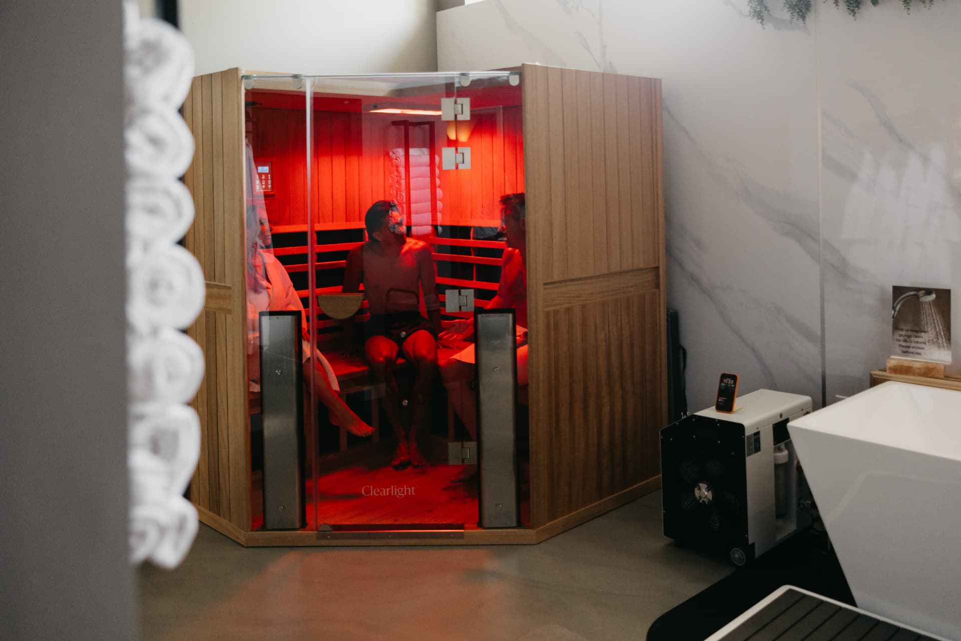 Members sharing the Clearlight social sauna at Recharge